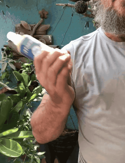 MOZZI bottle being shaken up and down
